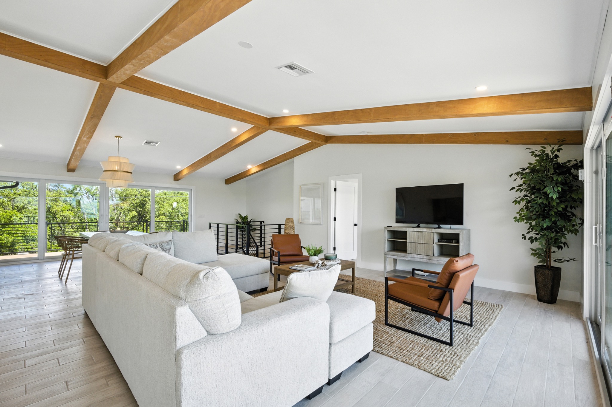 Luxury living room with vaulted ceilings and waterfront views